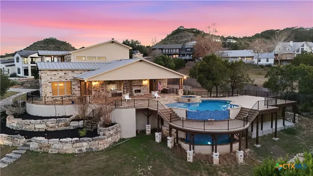 a view of a swimming pool with a lounge chair