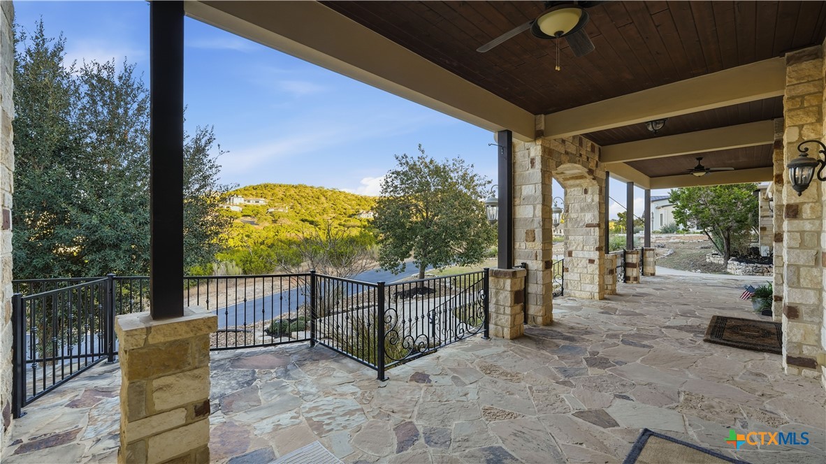 1035 Thunderbolt Rd Canyon Lake Canyon Lake, TX 78133 - Photo 11 of 48 a view of a porch with furniture and floor to ceiling window