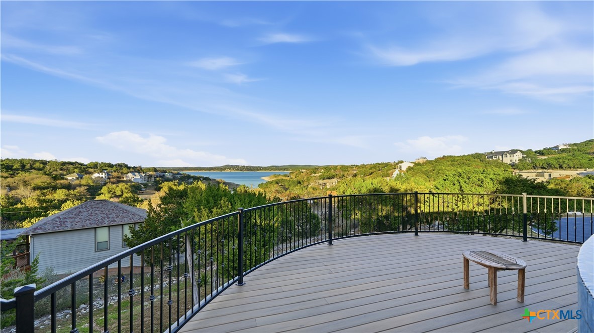 1035 Thunderbolt Rd Canyon Lake Canyon Lake, TX 78133 - Photo 14 of 48 a view of a balcony with wooden floor and city view