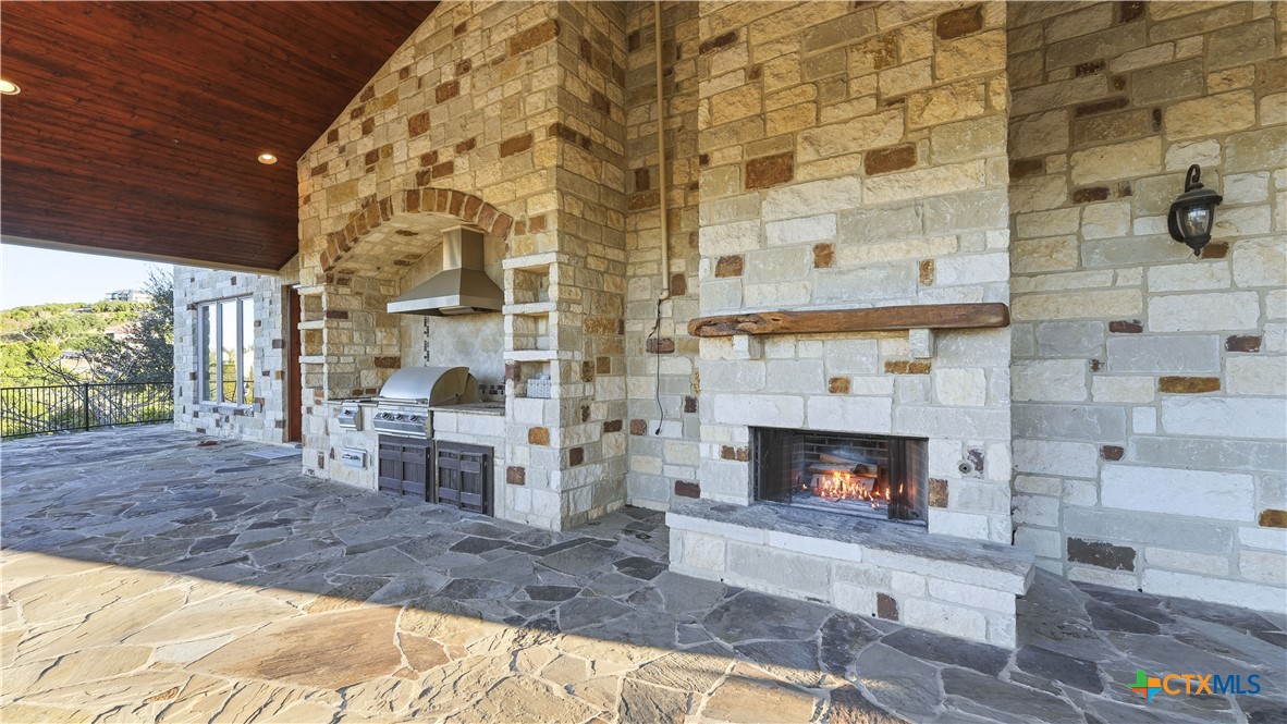 1035 Thunderbolt Rd Canyon Lake Canyon Lake, TX 78133 - Photo 21 of 48 a living room with furniture and a fireplace
