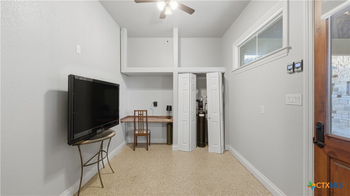 1035 Thunderbolt Rd Canyon Lake Canyon Lake, TX 78133 - Photo 29 of 48 a view of a livingroom with furniture and a flat screen tv