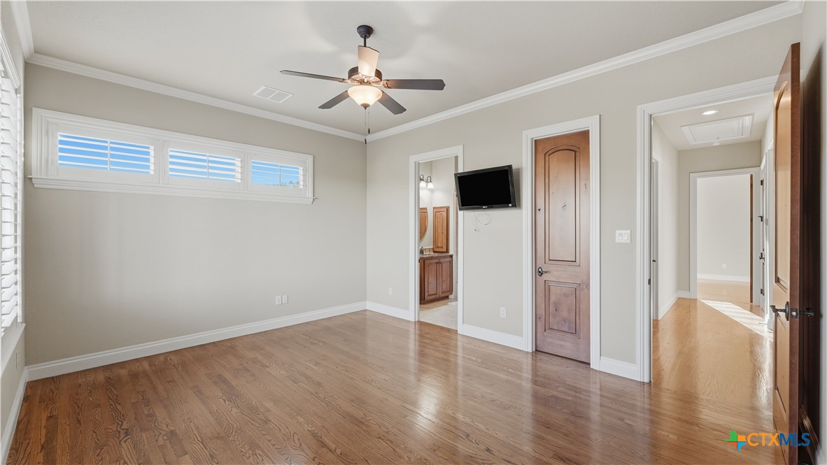 1035 Thunderbolt Rd Canyon Lake Canyon Lake, TX 78133 - Photo 31 of 48 a view of a livingroom with a chandelier fan and wooden floor