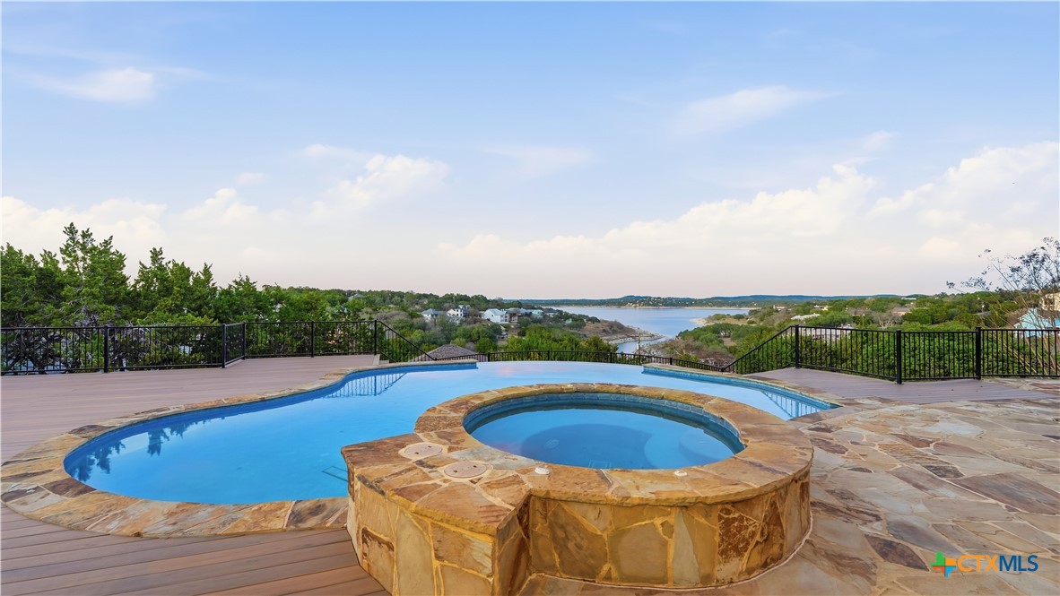 1035 Thunderbolt Rd Canyon Lake Canyon Lake, TX 78133 - Photo 6 of 48 a view of a swimming pool with a lounge chair