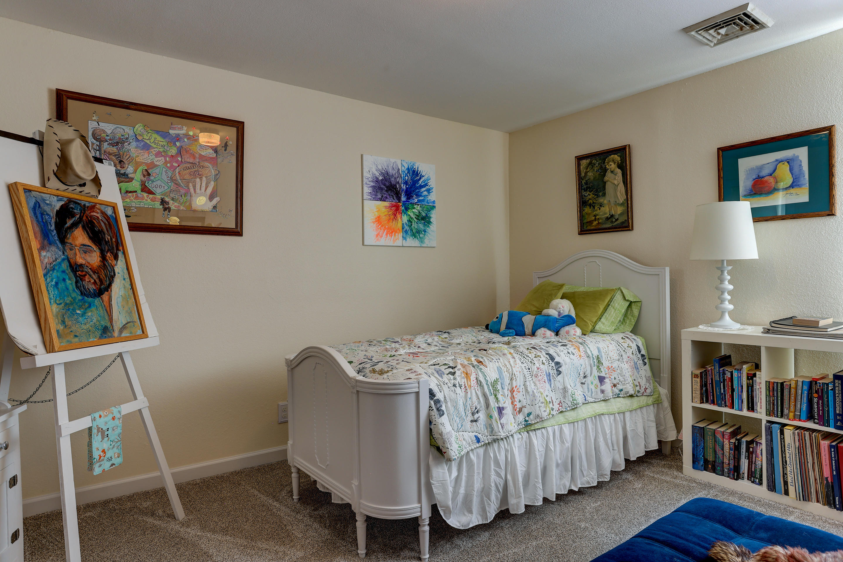 60875 Billadeau Road Bend, OR 97702 - Photo 29 of 42 a bedroom with a bed and a book shelf