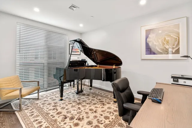 a workspace with furniture and a rug