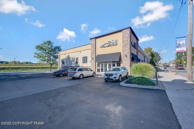 a view of a car park in front of a building