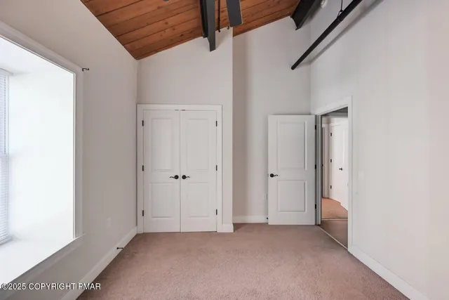 a view of a room with white walls