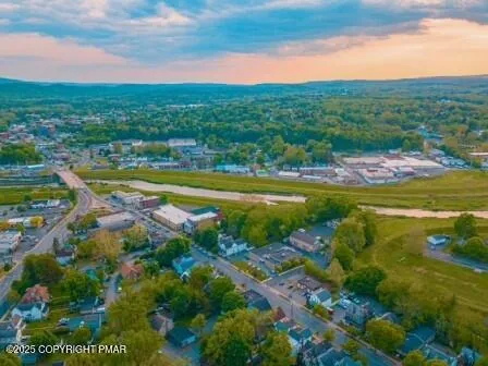 a view of a city with mountains in the background
