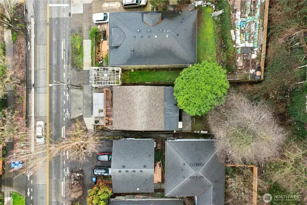 an aerial view of residential houses with outdoor space