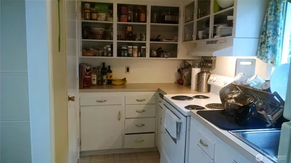 a kitchen with a cabinets and a stove