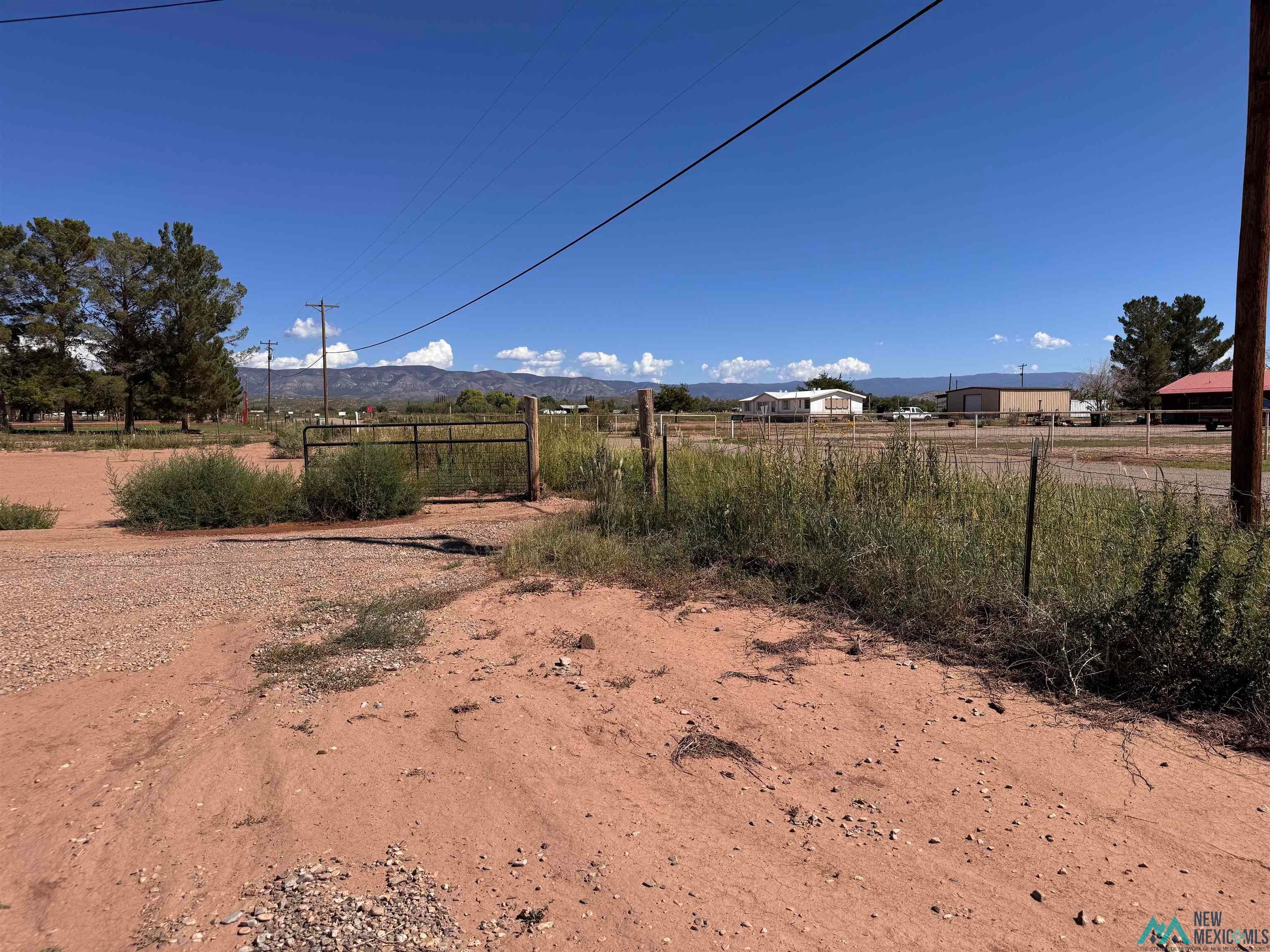 77 Northwest Bookout Road Tularosa, NM 88352 - Photo 31 of 33 View of yard with a mountain view and a view of rural / pastoral area