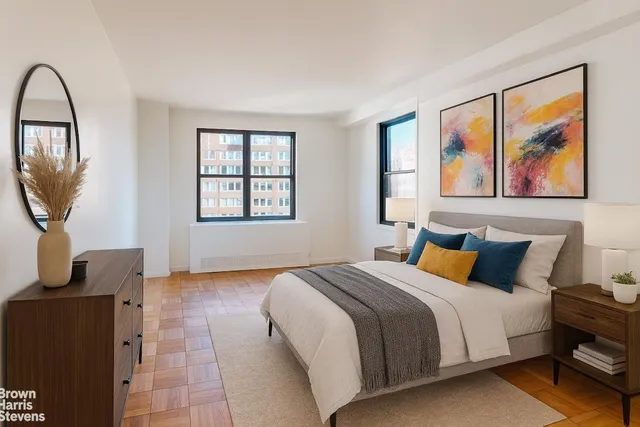 a bedroom with bed and window