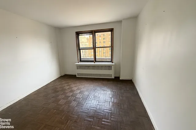 a white refrigerator freezer and a stove sitting inside of a kitchen
