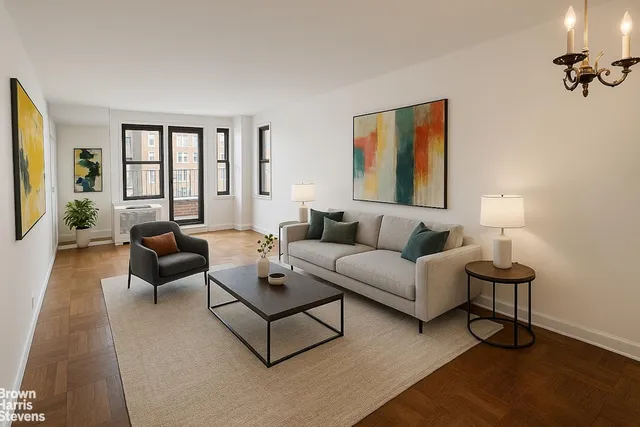 a living room with furniture rug and window