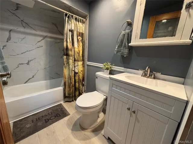 a bathroom with a shower and a tub