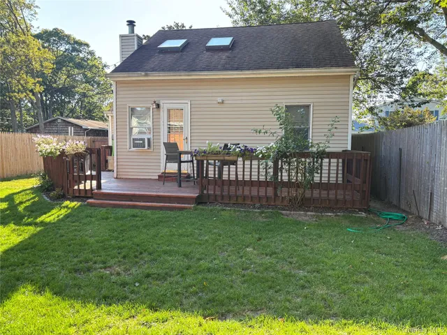 a front view of house with yard and outdoor seating