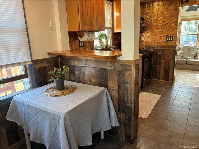a dining room with furniture and window