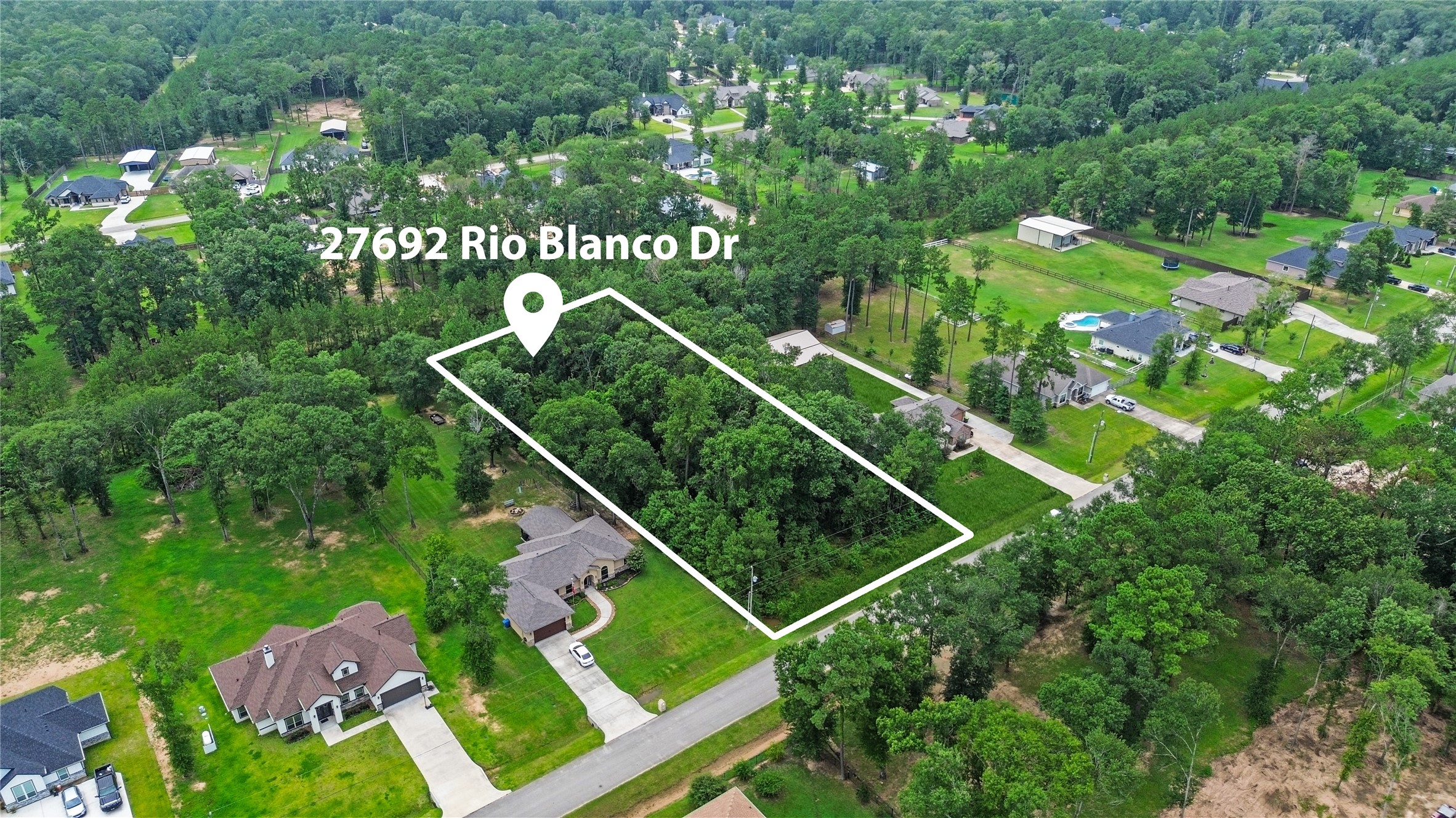 27692 Rio Blanco Drive Splendora, TX 77372 - Photo 11 of 11 a view of a house with a backyard