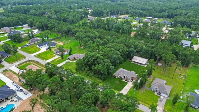 an aerial view of residential house with outdoor space and swimming pool