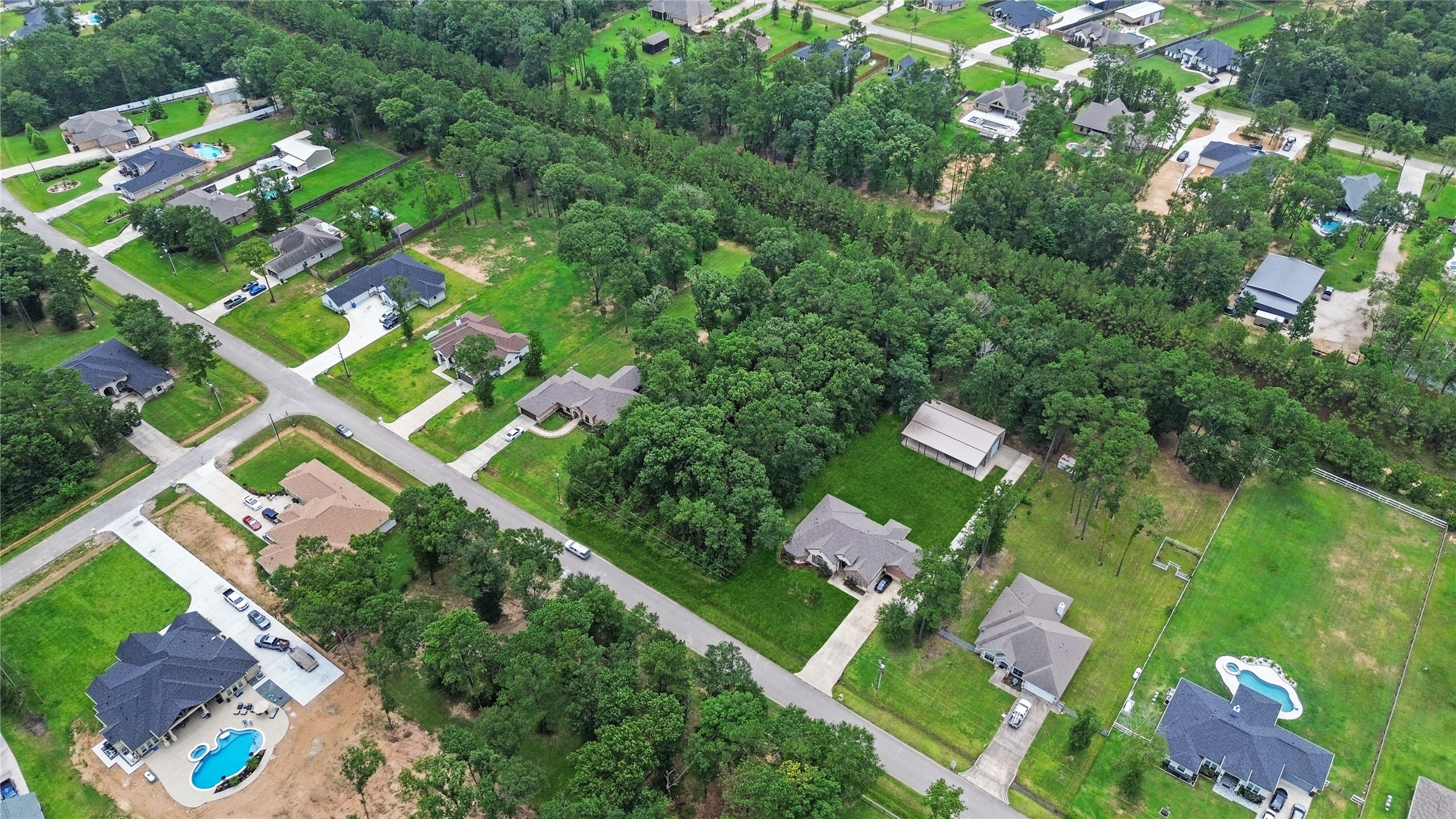 27692 Rio Blanco Drive Splendora, TX 77372 - Photo 6 of 11 an aerial view of a house with a yard