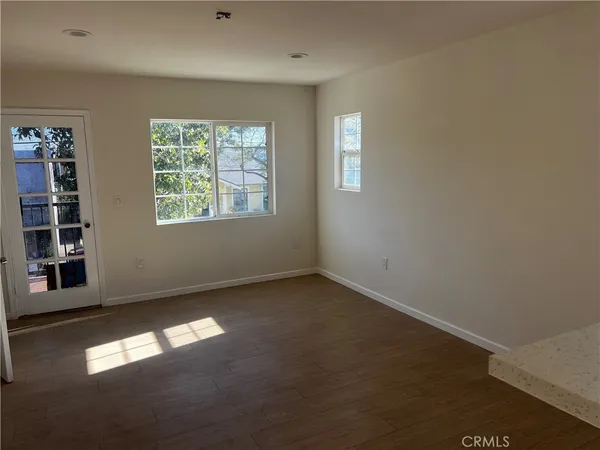 a view of empty room with windows