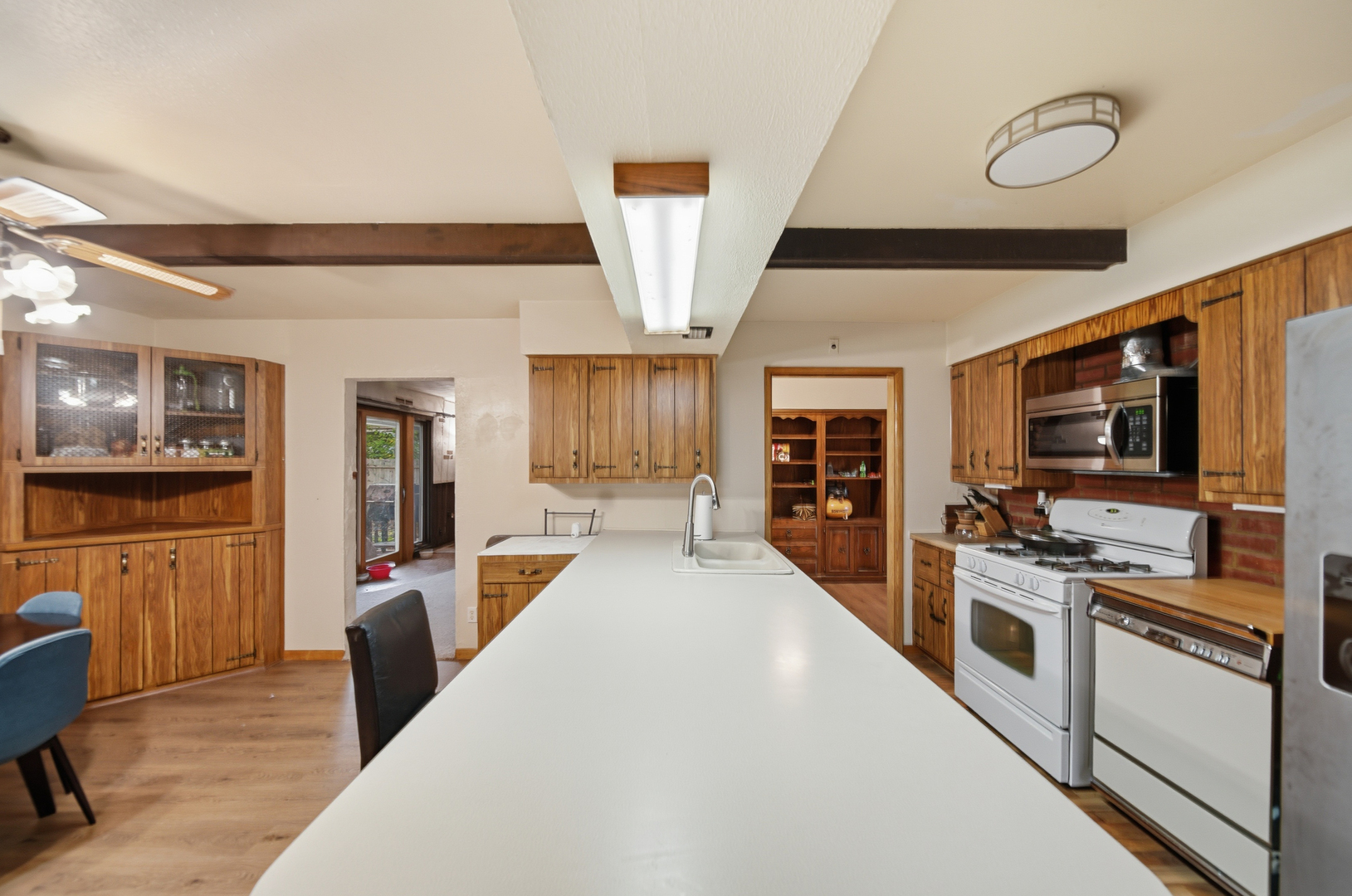 803 4th Avenue Dixon, IL 61021 - Photo 18 of 35 a large white kitchen with stainless steel appliances