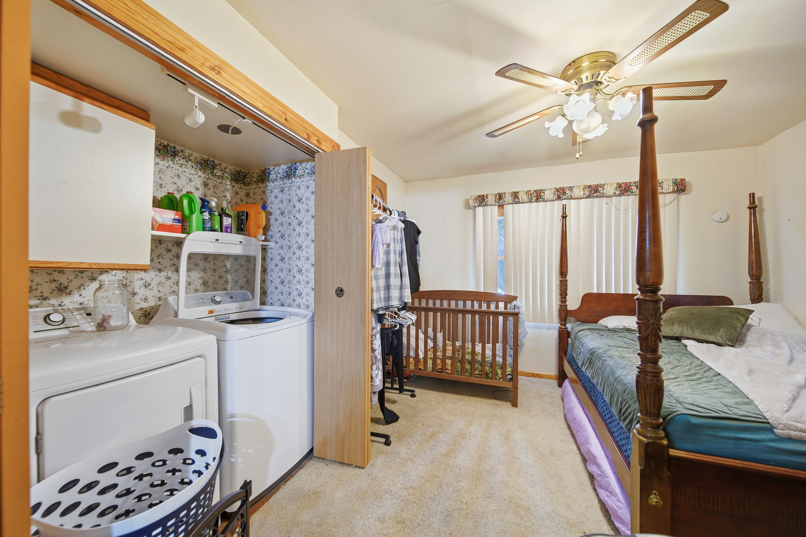 803 4th Avenue Dixon, IL 61021 - Photo 30 of 35 a bedroom with a bed and a chandelier