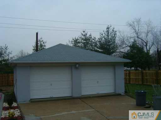 48 Lee Street Port Reading, NJ 07064 - Photo 2 of 4 a backyard of a house