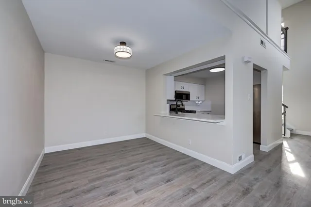 a view of kitchen with wooden floor