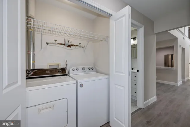 a view of storage and utility room with washer and dryer