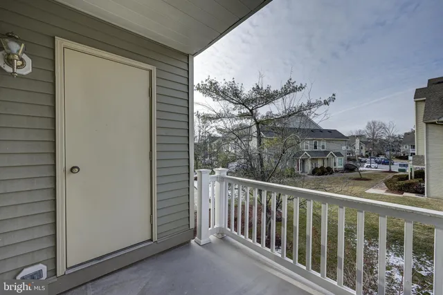 a view of a balcony with a potted plant