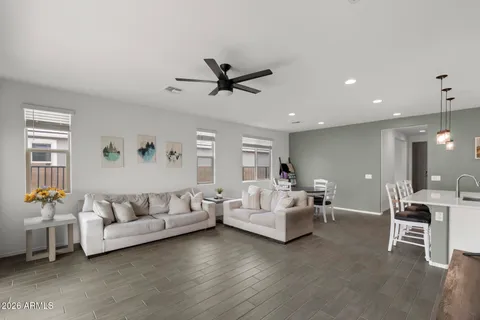 a living room with furniture and white walls