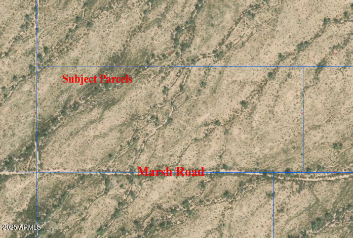 0 West Marsh Road, Unit 2 Stanfield, AZ 85172 - Photo 7 of 12 a street view with wooden fence and trees