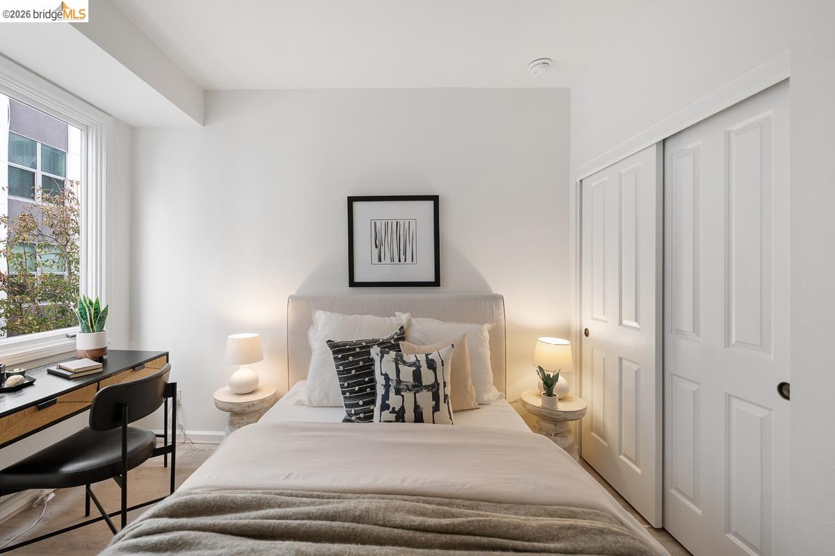 2029 Channing Way, Unit 3D Berkeley, CA 94704 - Photo 42 of 54 Bedroom featuring a large window, plush carpet flooring, and a built-in sliding panel closet