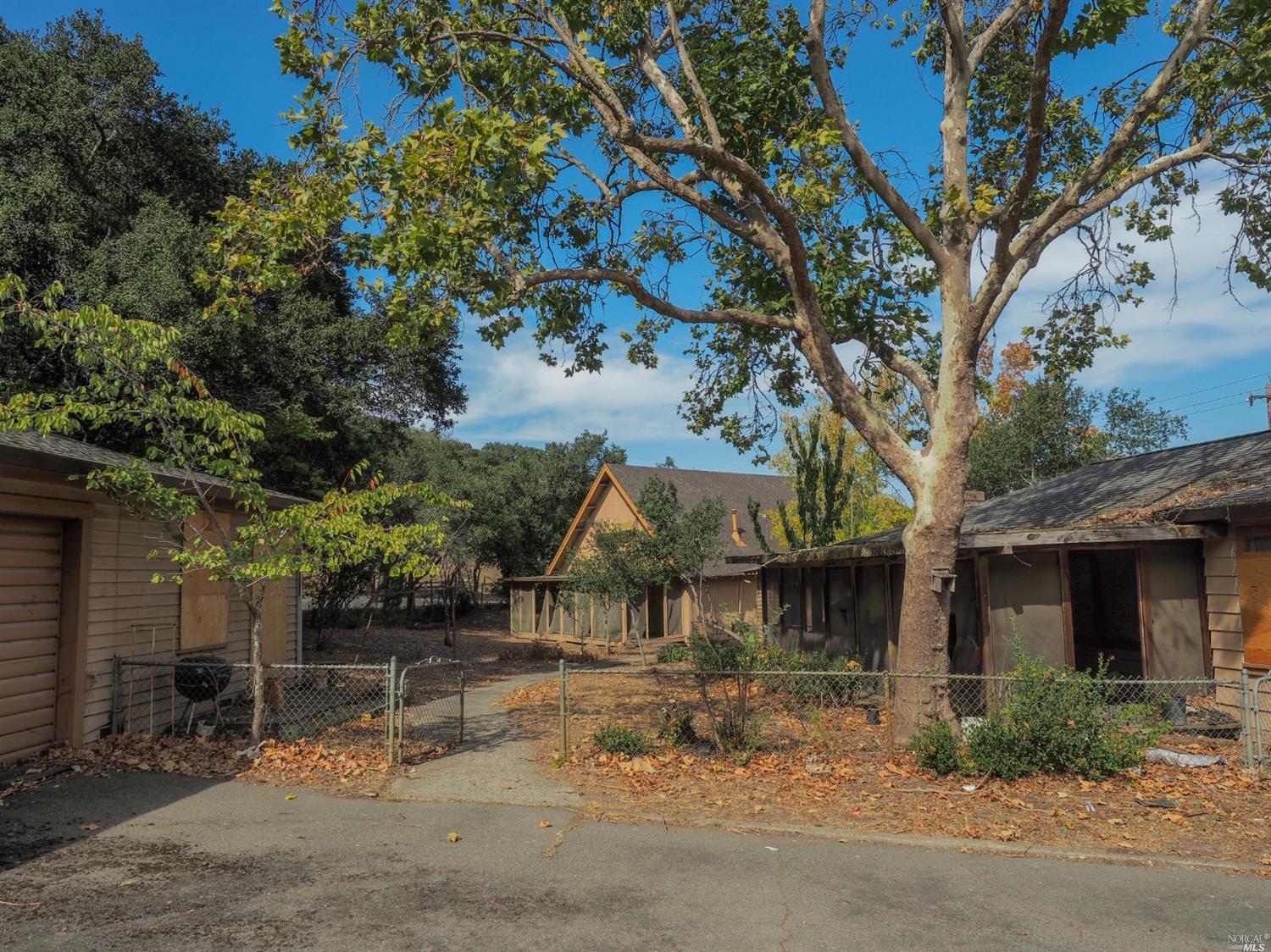 4018 Bennett Valley Road Santa Rosa, CA 95404 - Photo 1 of 1 Main house 2bed/2bath 1872sf on right, garage studio 1bed/1bath 308sf on left, and A-frame 2bed/1.5bath 1362sf center.