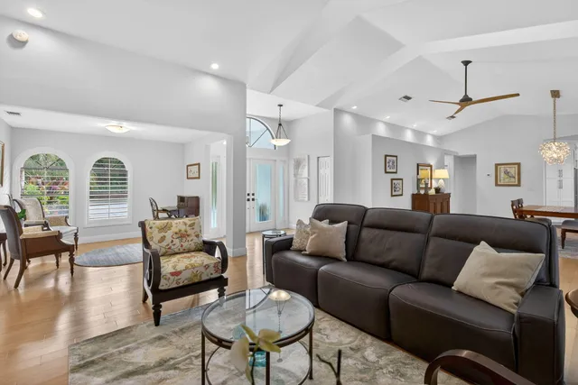 a view of a livingroom with furniture and a potted plant