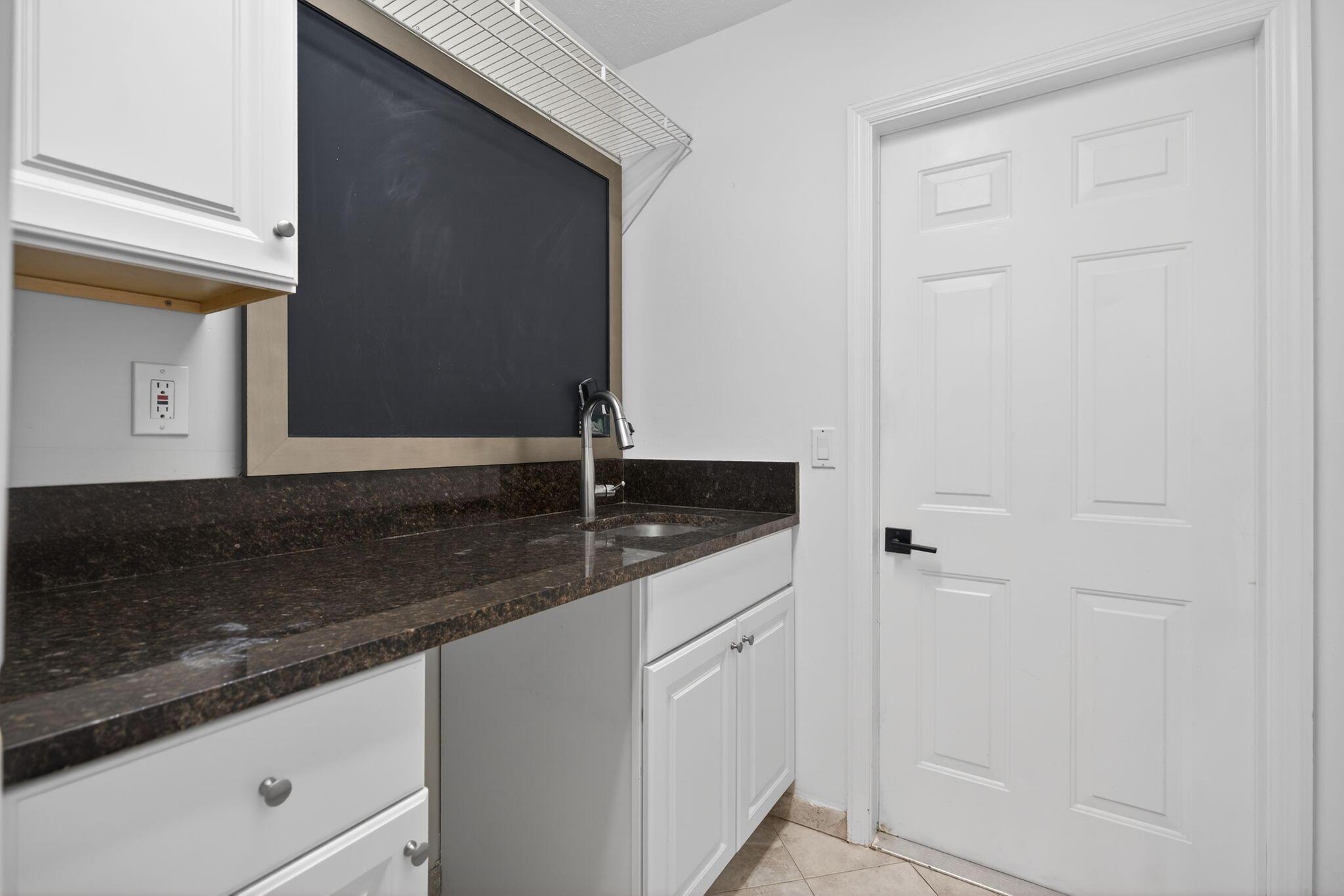 1488 Southeast Colony Way Jupiter, FL 33478 - Photo 27 of 51 a bathroom with a granite countertop sink and a mirror