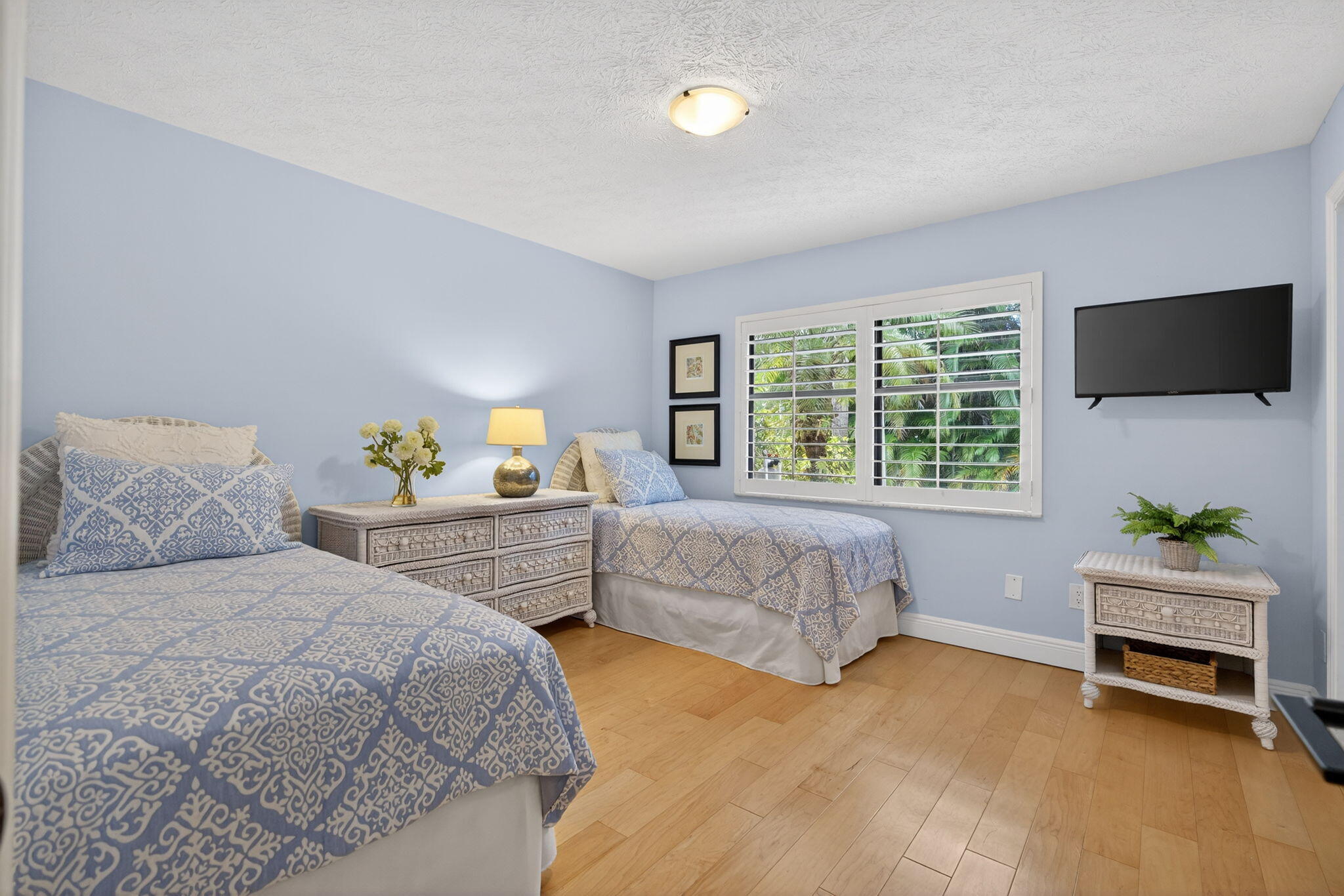 1488 Southeast Colony Way Jupiter, FL 33478 - Photo 29 of 51 a bedroom with a bed and a couch