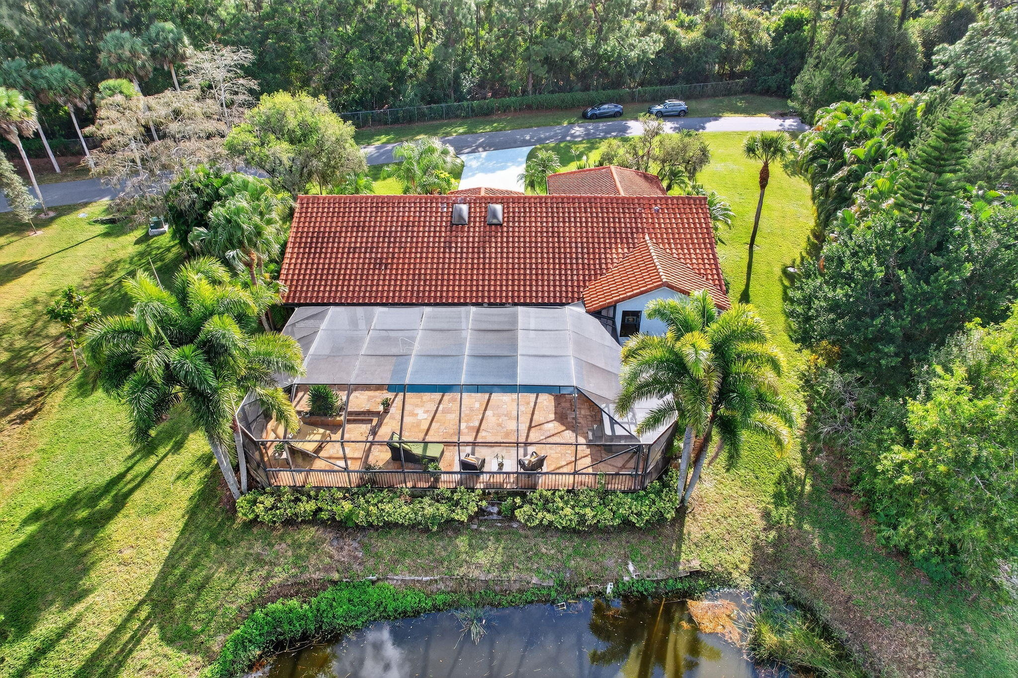 1488 Southeast Colony Way Jupiter, FL 33478 - Photo 3 of 51 an aerial view of residential house with outdoor space and swimming pool