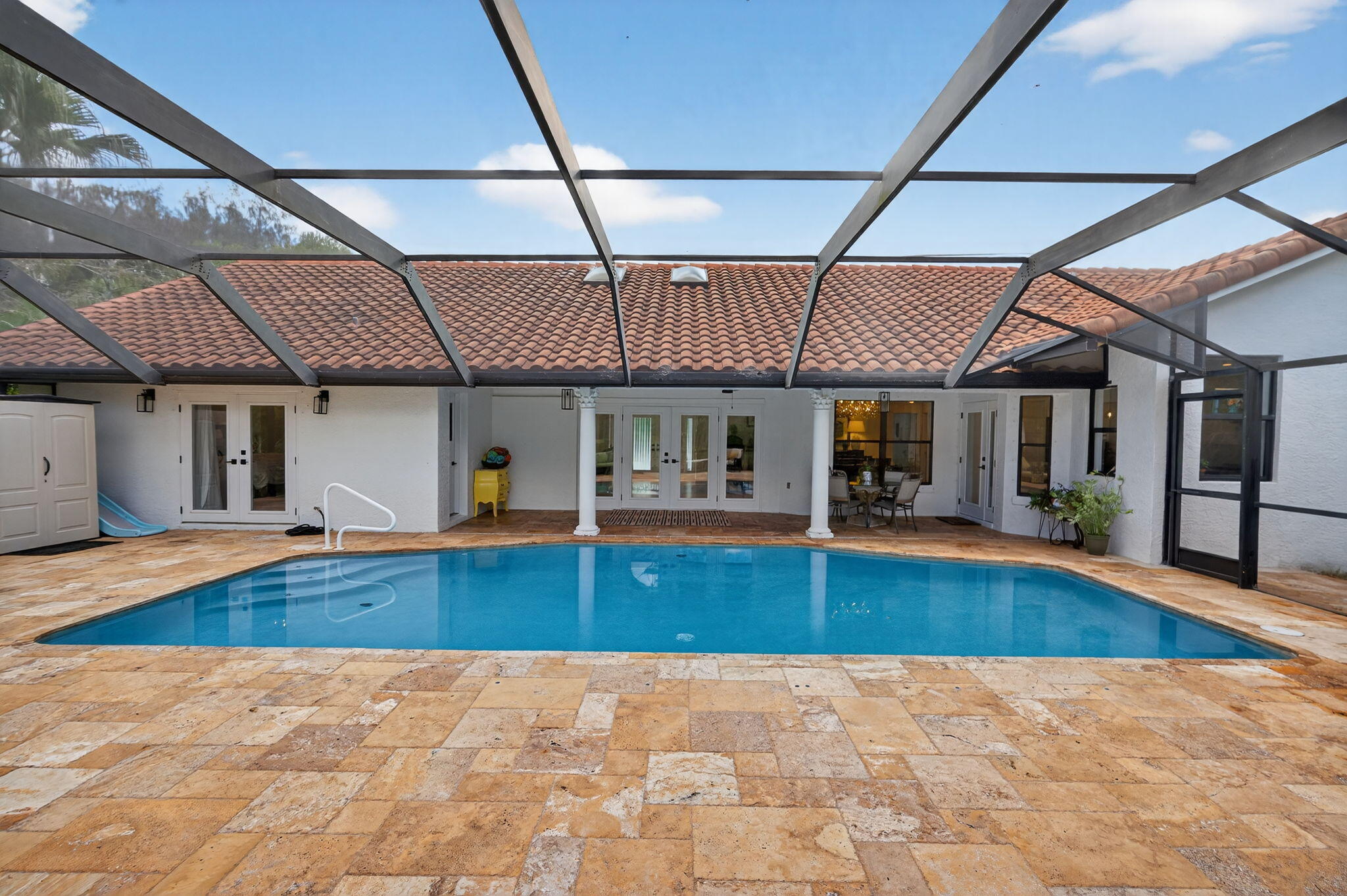 1488 Southeast Colony Way Jupiter, FL 33478 - Photo 36 of 51 Pool w/ view of expansive doors/windows