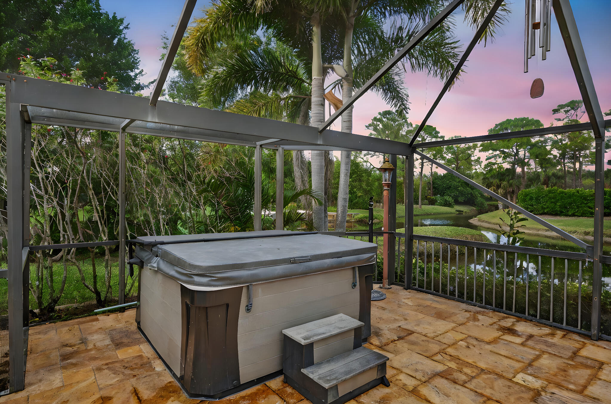 1488 Southeast Colony Way Jupiter, FL 33478 - Photo 38 of 51 a view of a patio with a table and chairs