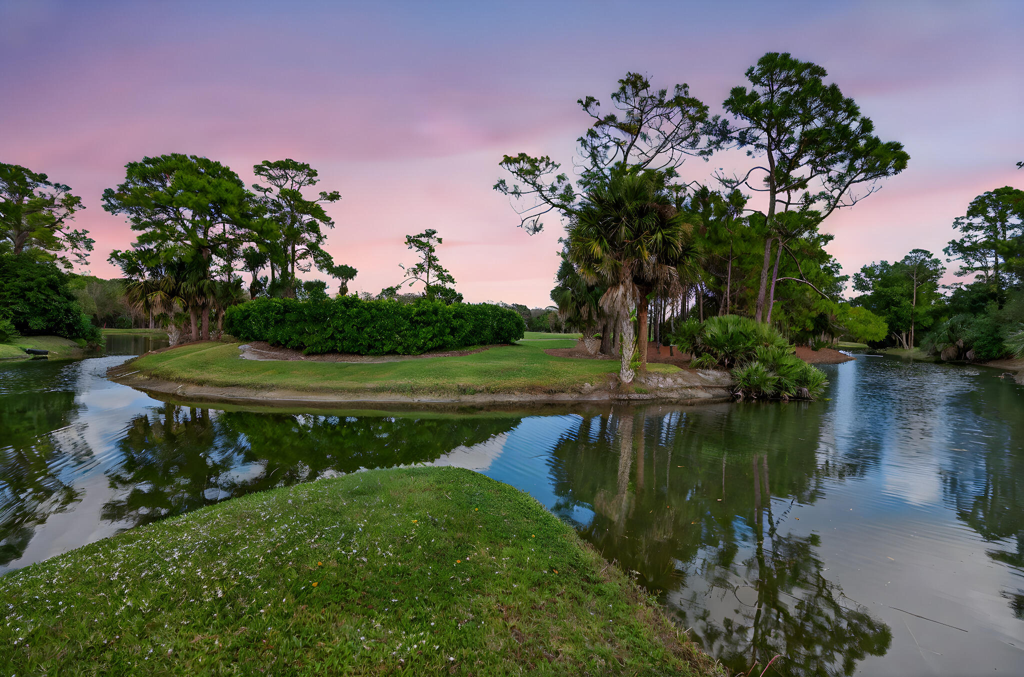 1488 Southeast Colony Way Jupiter, FL 33478 - Photo 40 of 51 a view of a lake with a house in the background
