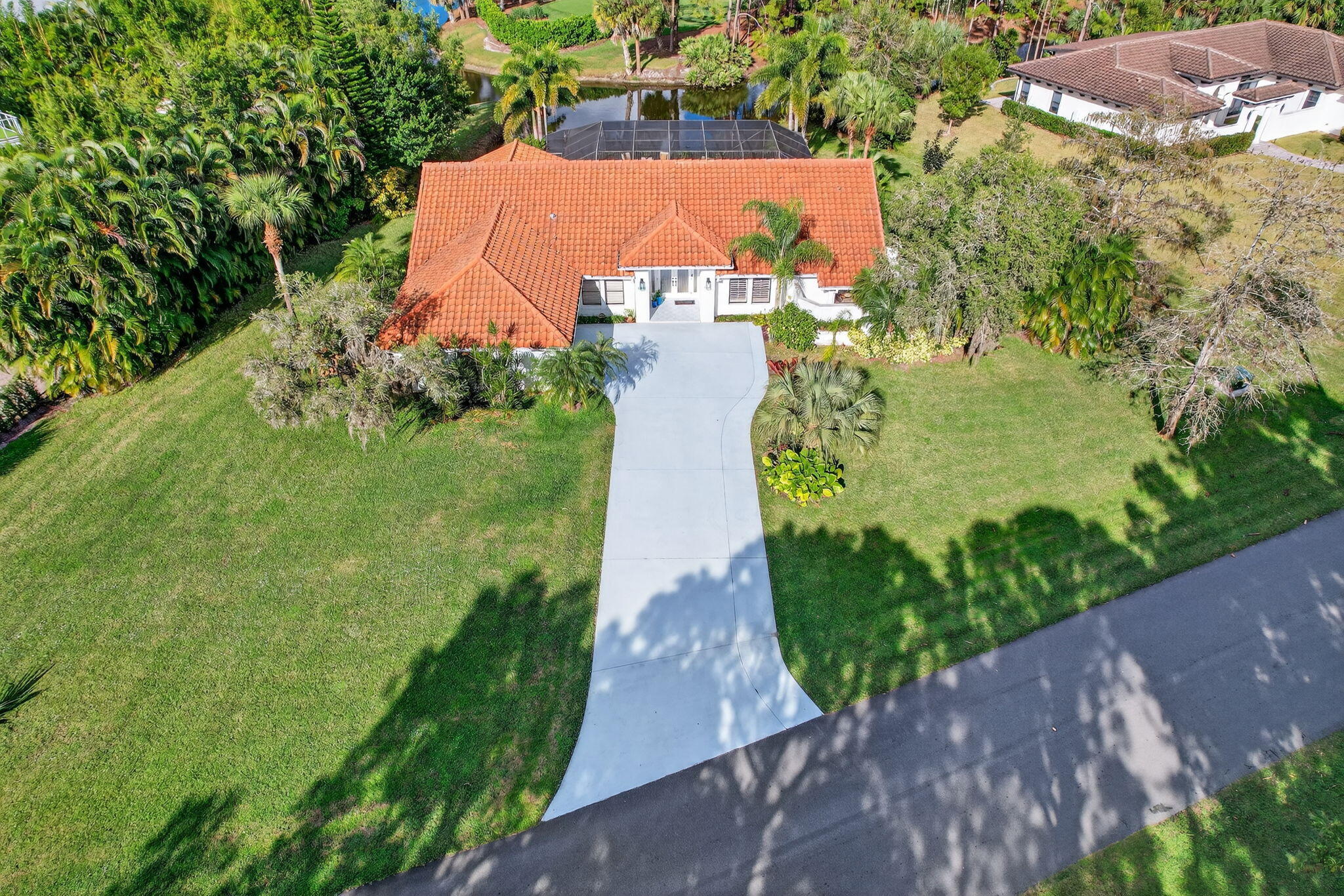1488 Southeast Colony Way Jupiter, FL 33478 - Photo 42 of 51 an aerial view of a house with a yard and garden