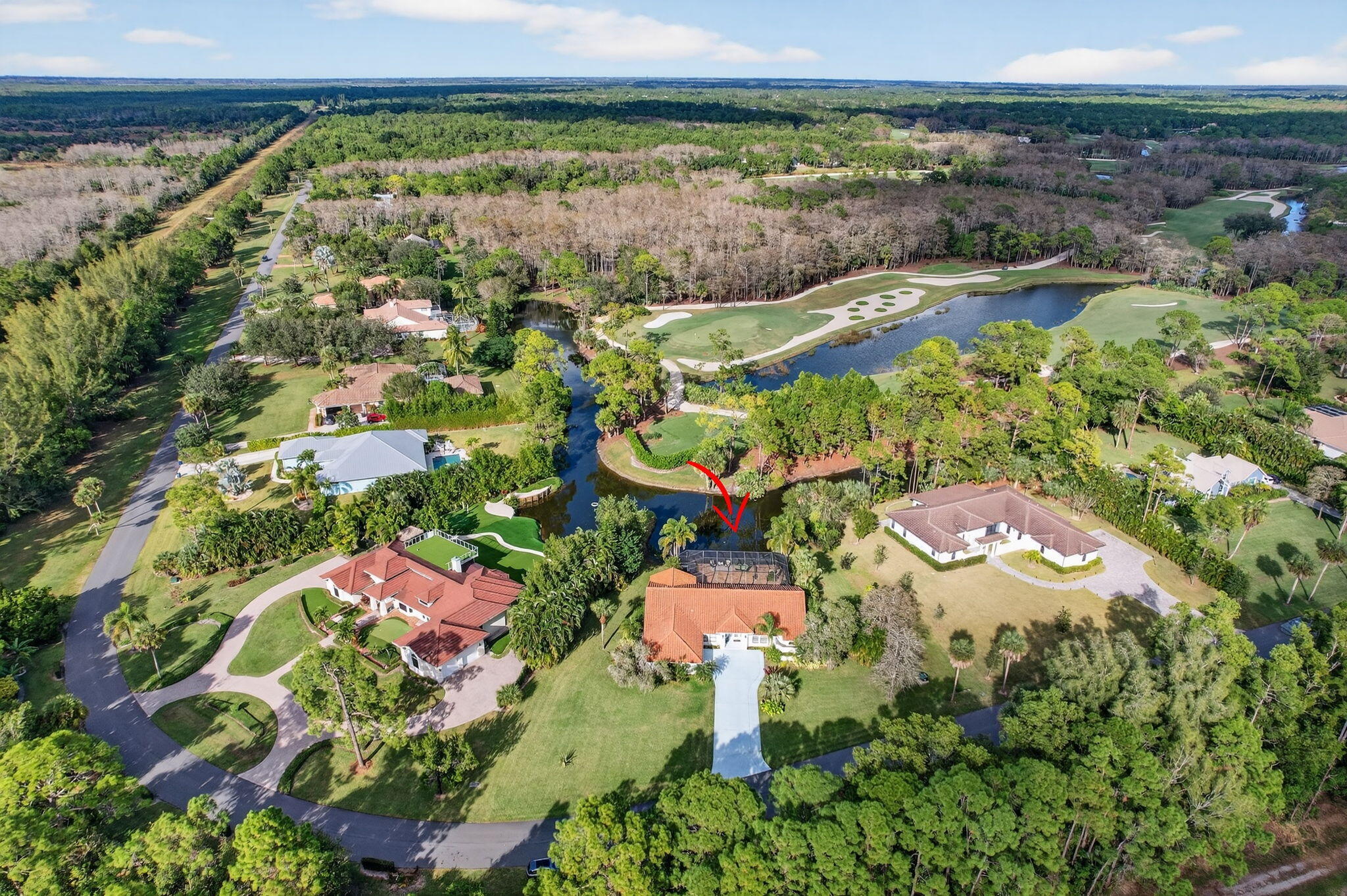 1488 Southeast Colony Way Jupiter, FL 33478 - Photo 50 of 51 an aerial view of residential houses with outdoor space