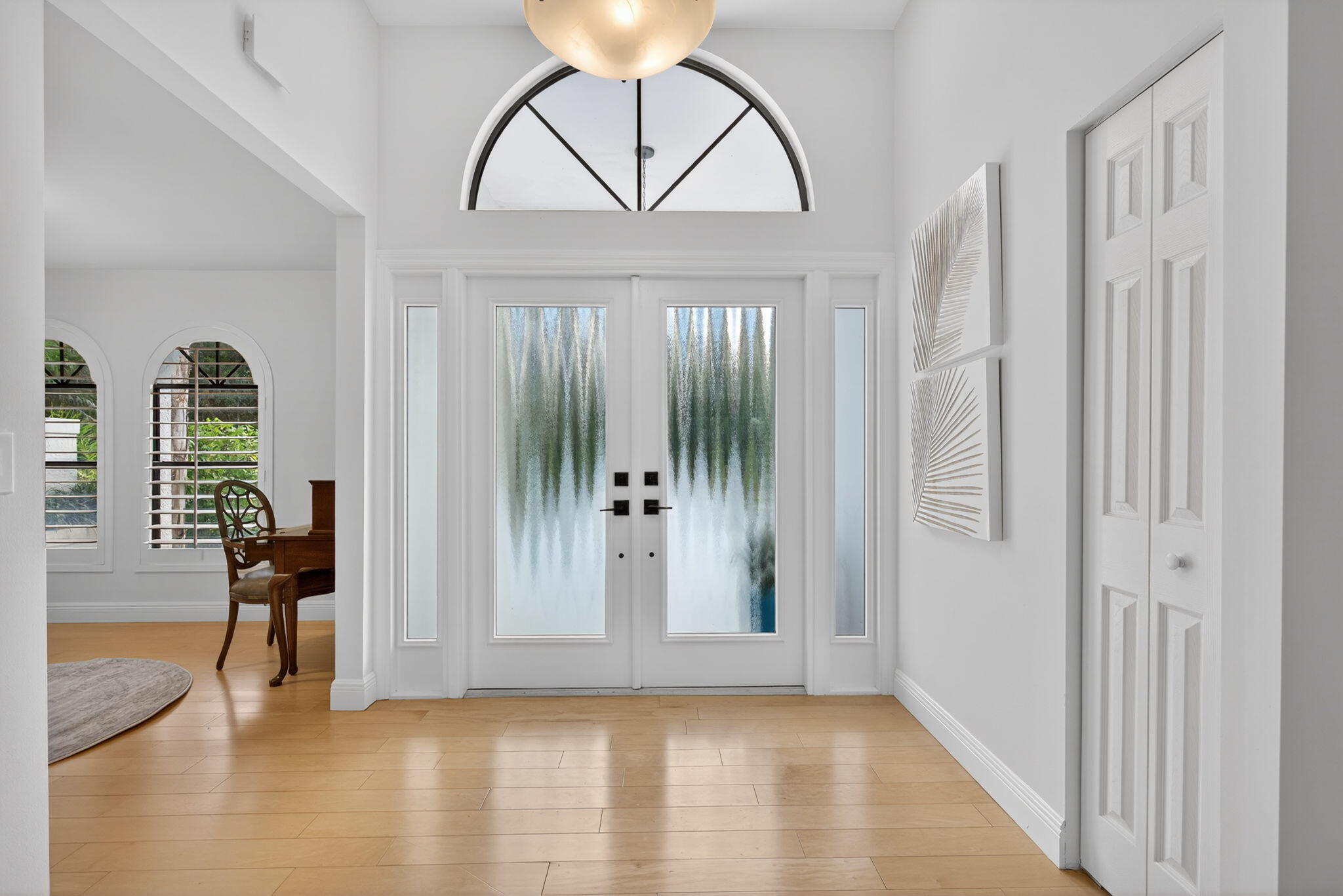 1488 Southeast Colony Way Jupiter, FL 33478 - Photo 7 of 51 a view of an entryway with wooden floor