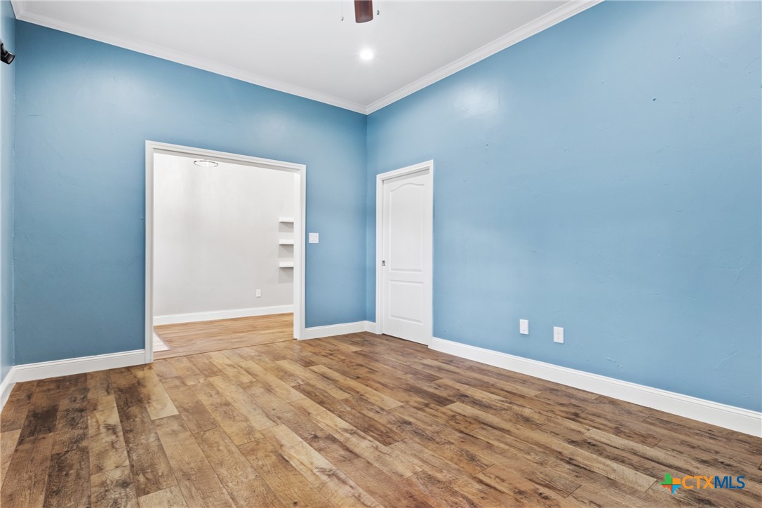 275 Woodruff Road Waco, TX 76705 - Photo 12 of 45 a view of an empty room with wooden floor