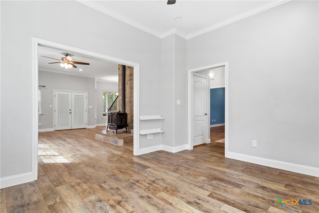 275 Woodruff Road Waco, TX 76705 - Photo 21 of 45 an empty room with wooden floor and windows