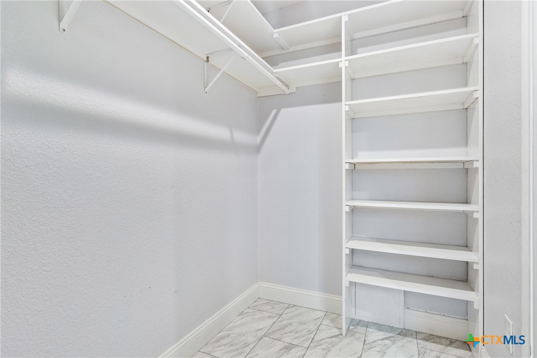 275 Woodruff Road Waco, TX 76705 - Photo 29 of 45 a view of walk in closet with empty racks