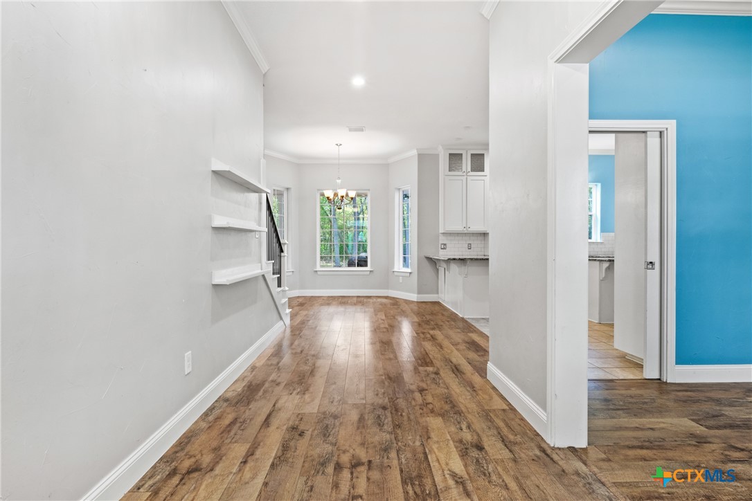 275 Woodruff Road Waco, TX 76705 - Photo 4 of 45 a view of a room with wooden floor and a window