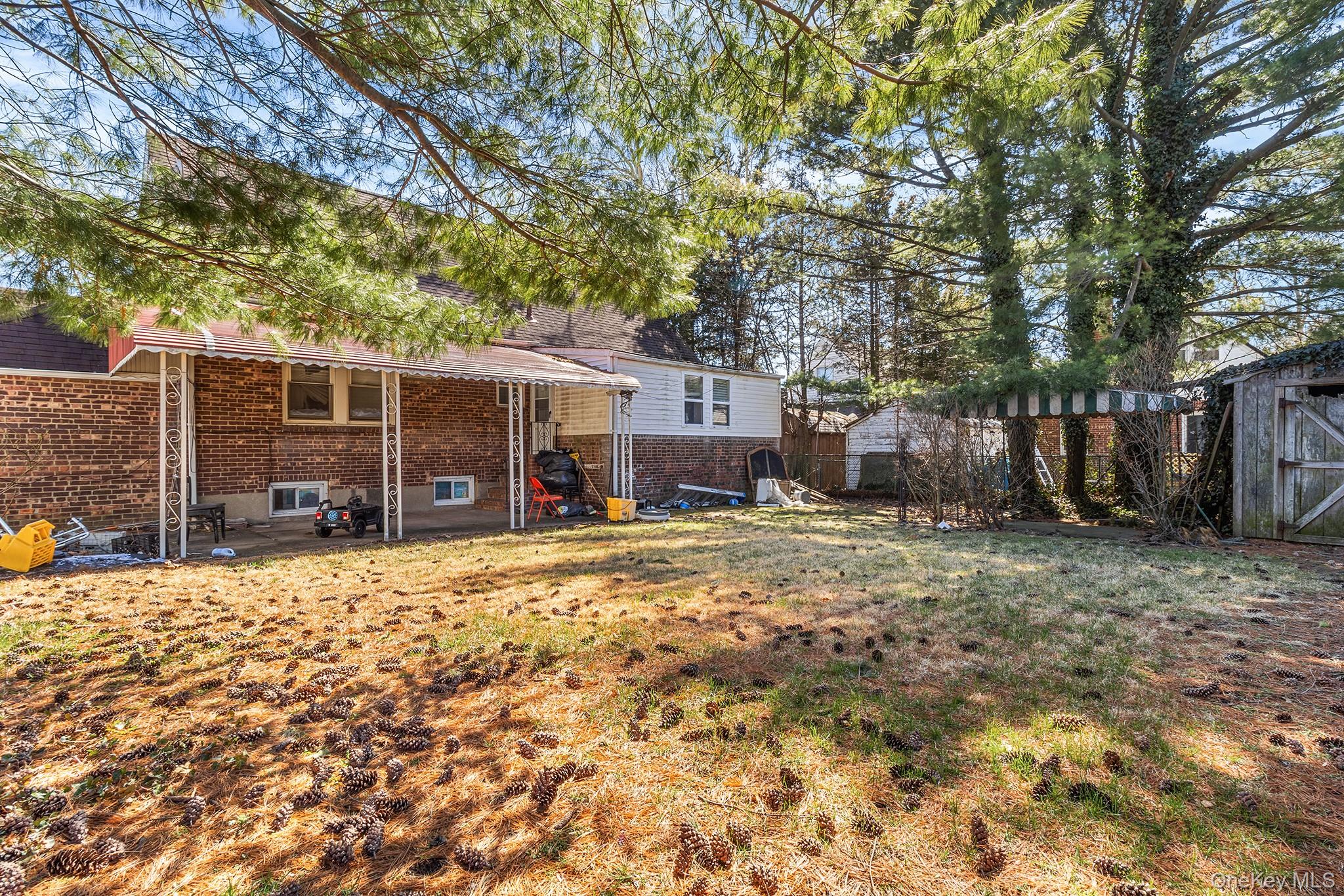 11 Henry Street Valley Stream, NY 11580 - Photo 4 of 4 a view of a house with a yard and sitting area